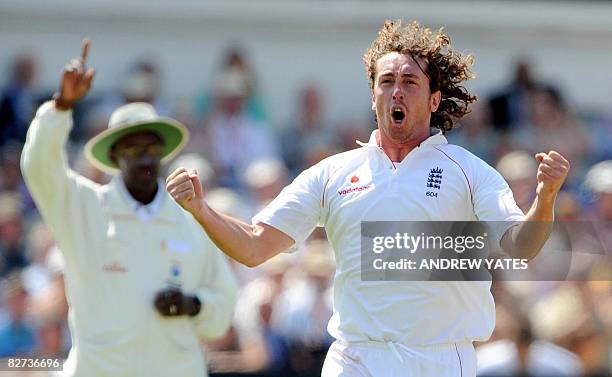 England cricketer Ryan Sidebottom celebrates after taking the wicket of New Zealand's Gareth Hopkins during the fourth day of the third test match at...