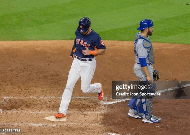 Houston Astros left fielder Derek Fisher scores a run in the fifth inning of the MLB game between the Toronto Blue Jays and Houston Astros on August...