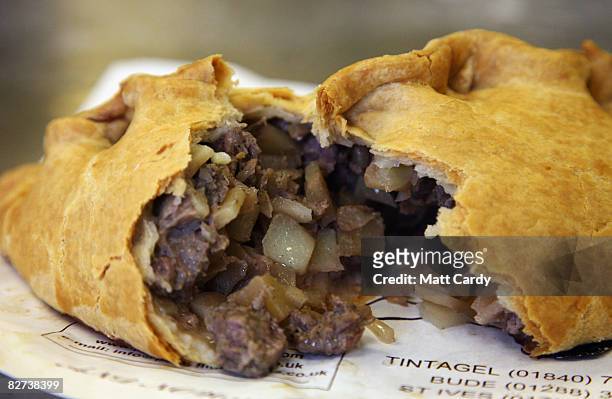 Pengenna Pasties version of a Cornish pasty is opened after being cooked in their bakery in Bude on September 9 2008 in Cornwall, England. The EU is...