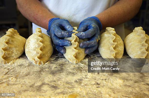 Julie Martin from Pengenna Pasties prepares their version of a Cornish pasty in their bakery in Bude on September 9 2008 in Cornwall, England. The EU...