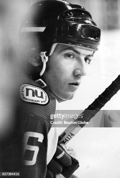 Northeastern University's Jim Martel watches the game from the penalty box during the second period of a game against the University of Vermont at...