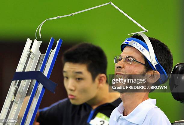 Grigorios Polychronidis of Greece reacts to a poor shot as South Korea's Park Keon-Woo looks on in their boccia individual BC3 category gold medal...