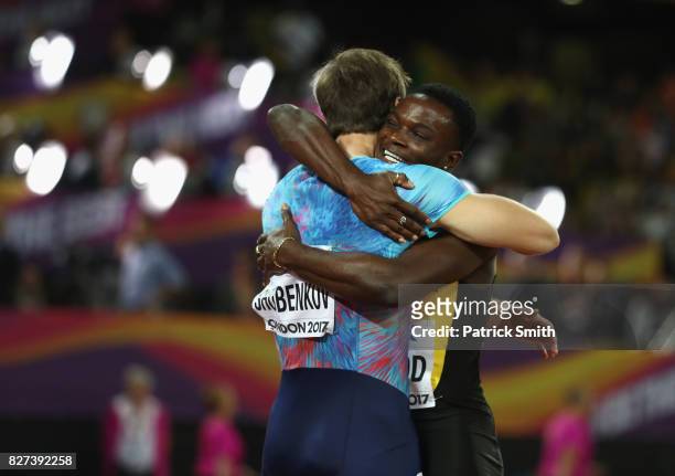 Omar McLeod of Jamaica celebrates with Sergey Shubenkov after winning the Men's 110 metres hurdles final during day four of the 16th IAAF World...