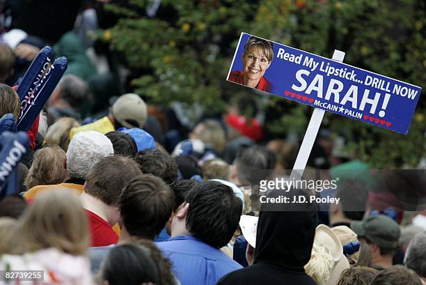 Supporter holds up a sign as Republican presidential nominee U.S. Sen. John McCain and vice-presidential candidate, Alaska Gov. Sarah Palin speak at...