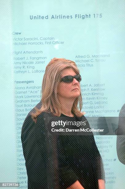 Woman stands inside the newly erected Boston Logan International Airport 9-11 Memorial, for victims of flights United Airlines 175 and American...