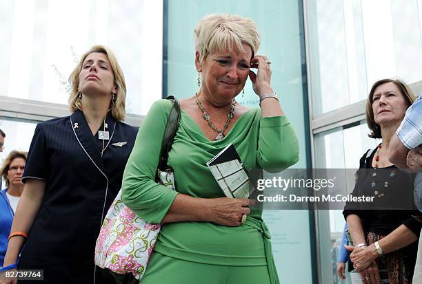 Marilyn DeAvilla cries while viewing the newly erected Boston Logan International Airport 9-11 Memorial for victims of flights United Airlines 175...