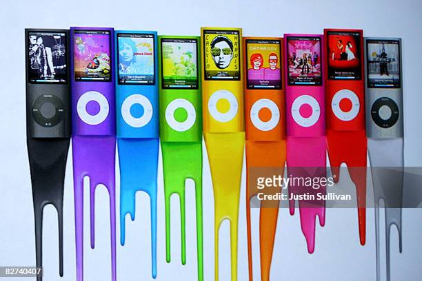 An ad shows colors of the new iPod Nano as Apple CEO Steve Jobs speaks during a special event September 9, 2008 in San Francisco, California. Jobs...