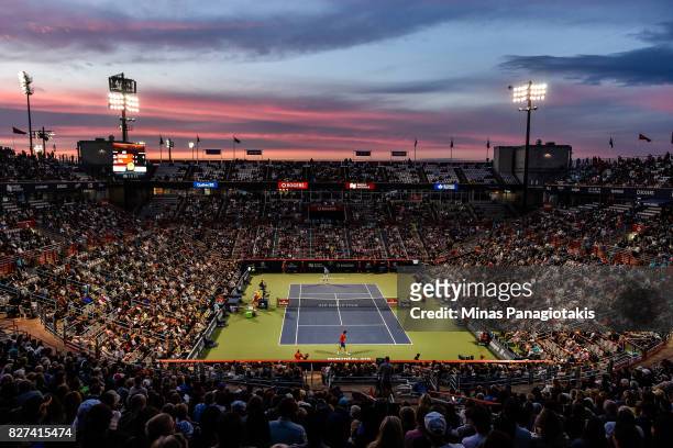 General view of centre court as the sun sets during the match between John Isner of the United States and Juan Martin del Potro of Argentina on day...