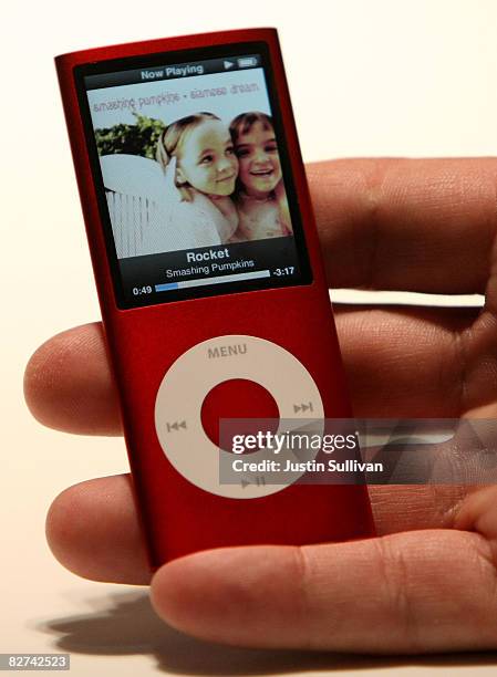 An Apple employee holds the new iPod Nano is displayed during an Apple special event September 9, 2008 in San Francisco, California. Apple CEO Steve...