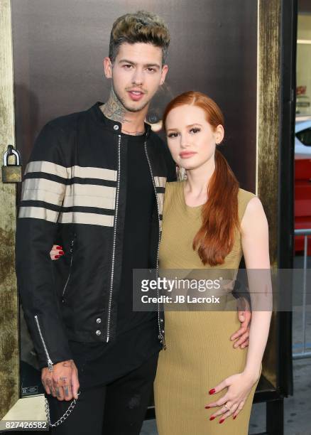 Travis Mills and Madelaine Petsch attend the premiere of New Line Cinema's 'Annabelle: Creation' on August 07, 2017 in Los Angeles, California.
