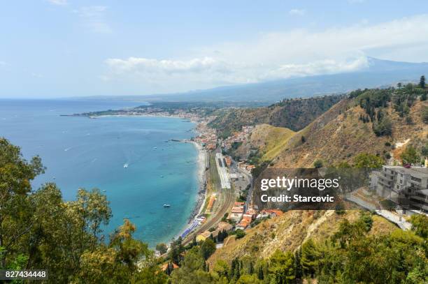 sicilian coastline near taormina - giardini naxos, italy - naxos sicily stock pictures, royalty-free photos & images