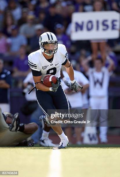 Austin Collie of the BYU Cougars runs with the ball during their game against the Washington Huskies on September 6, 2008 at Husky Stadium in...