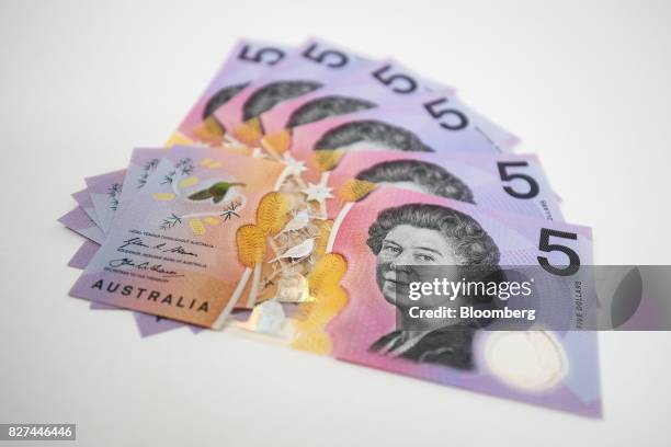 Australian five dollar banknotes are arranged for a photograph in Sydney, Australia, on Friday, Aug. 4, 2017. The Australian dollar rose for the...