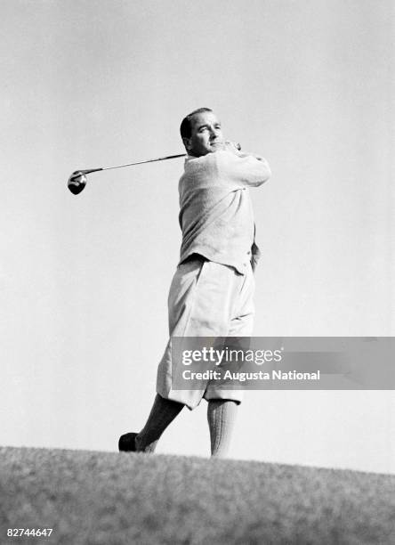 Gene Sarazen takes a swing shot from a hill during a Masters Tournament at Augusta National Golf Club in the 1930s in Augusta, Georgia.