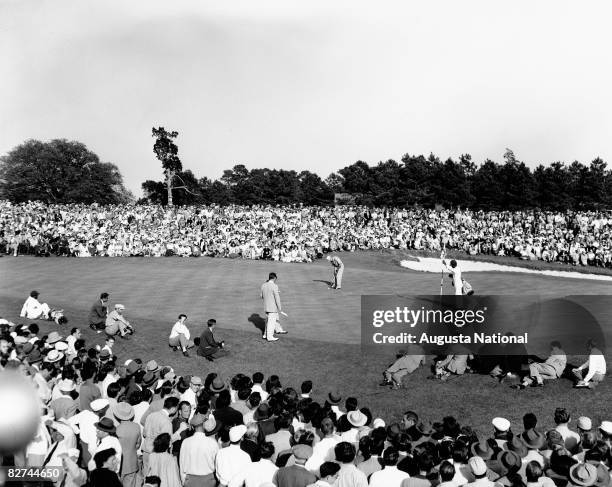 Sam Snead putts in front of a gallery of patrons to win the 1949 Masters Tournament at Augusta National Golf Club held April 7-10, 1949 in Augusta,...