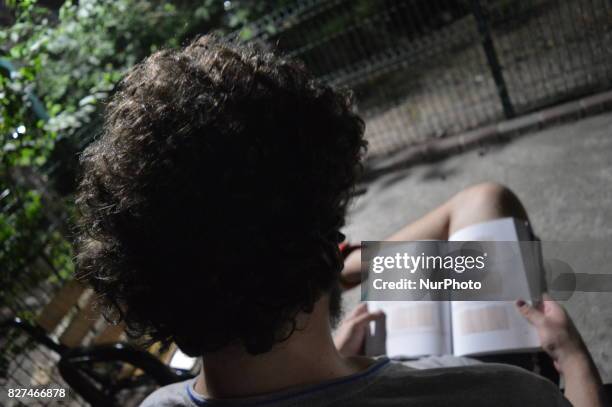 Man reads an educational book in Ankara, Turkey on August 07, 2017. The Turkish government takes a giant step in Turkey's education system with...