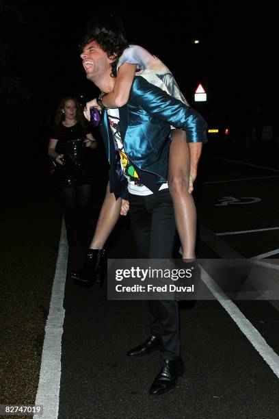 Katy Perry gets a piggyback from Mika while leaving the Serpentine Gallery Summer Party at The Serpentine Gallery on September 9, 2008 in London,...