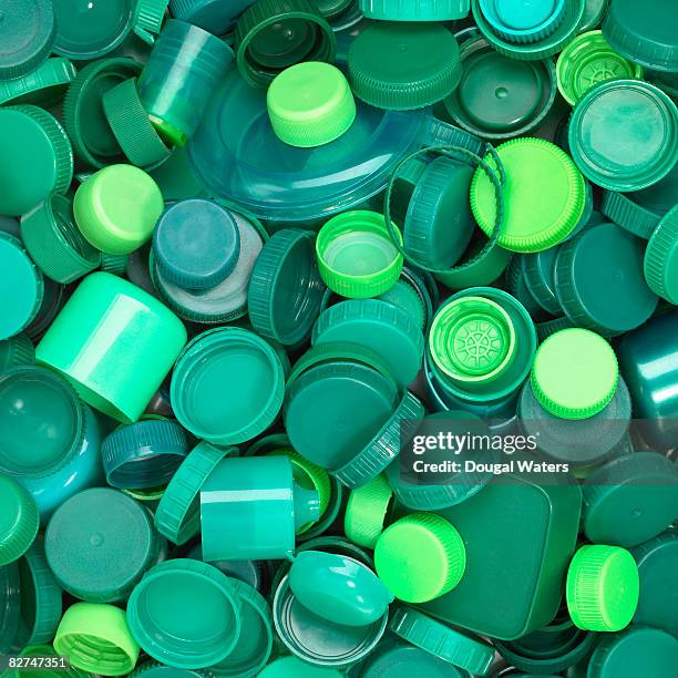 green plastic lids close up. - plastic stock pictures, royalty-free photos & images