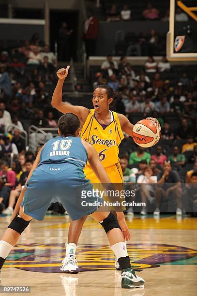 Shannon Bobbitt of the Los Angeles Sparks moves the ball against Lindsey Harding of the Minnesota Lynx during the game on September 1, 2008 at...