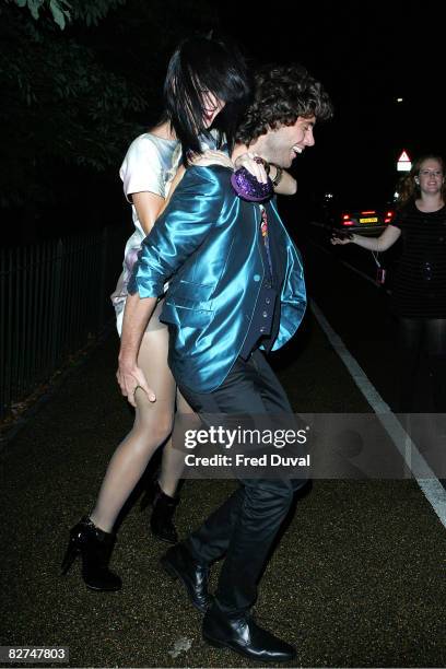 Katy Perry gets a piggyback from Mika while leaving the Serpentine Gallery Summer Party at The Serpentine Gallery on September 9, 2008 in London,...