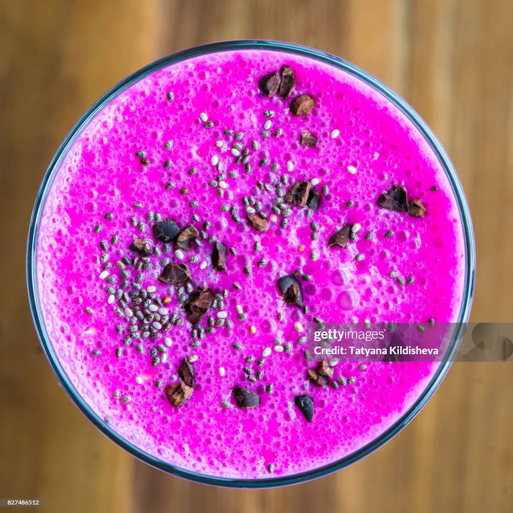 Açaí berry and red dragon fruit smoothie with chia seeds and cocoa cacao nibs