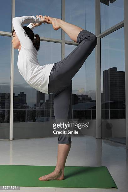 yoga student in the lord of the dance pose - lord of the dance pose stock pictures, royalty-free photos & images