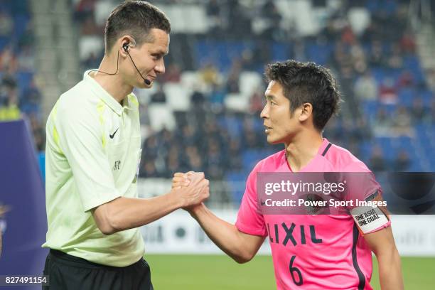 Referee Aziz Asimov of Uzbekistan and Kashima Midfielder Ryota Nagaki during the AFC Champions League 2017 Group E match between Ulsan Hyundai FC vs...