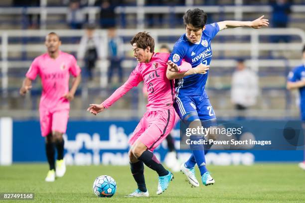 Kashima Midfielder Doi Shoma fights for the ball with Ulsan Hyundai Defender Kim Changsoo during the AFC Champions League 2017 Group E match between...