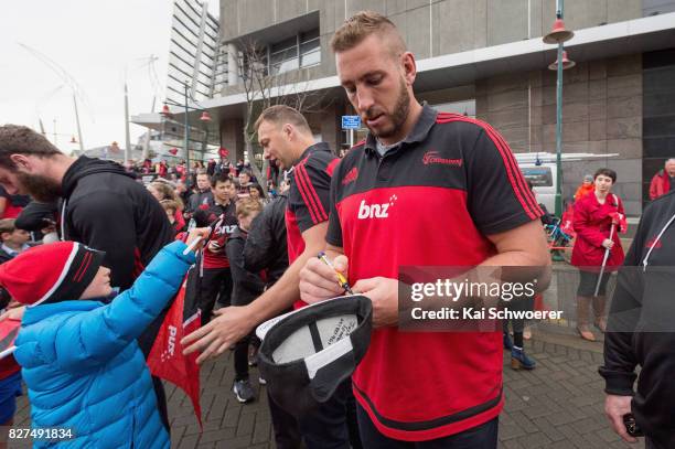 Luke Romano of the Crusaders greets fans during a parade at Christchurch Art Gallery on August 8, 2017 in Christchurch, New Zealand. The Crusaders...