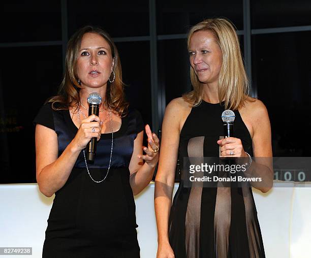Anne Wojcicki and Linda Avay introduce themselves during the 23 and Me Spit party at the IAC Building on September 9, 2008 in New York City.