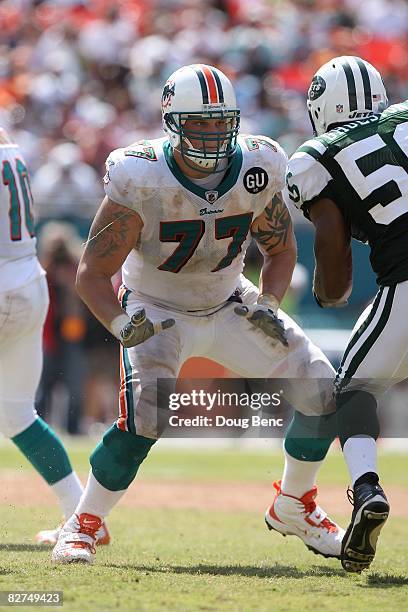 Offensive tackle Jake Long of the Miami Dolphins pass blocks against the New York Jets at Dolphin Stadium on September 7, 2008 in Miami, Florida. The...