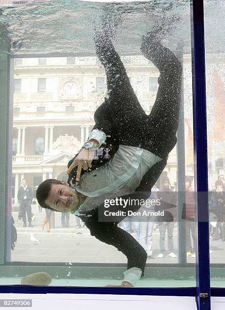 Jason Dundas showcases designs during the Cosmopolitan Neutrogena Underwater Fashion Shoot at Customs House on September 10, 2008 in Sydney,...