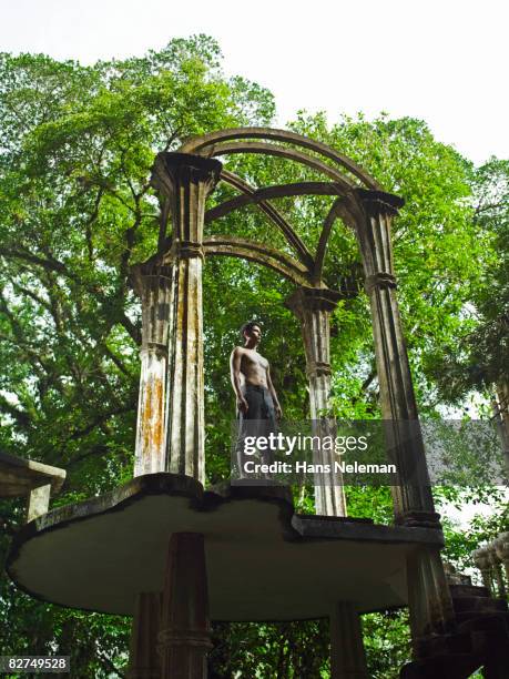 young man standing in a surreal structure - las posas stock pictures, royalty-free photos & images