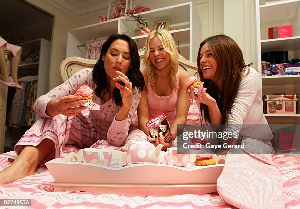 Newsreader Sara Groen, Model Jamie Wright and Kirsty Lee-Allan pose in bed for the launch of 'Girls Night In' at the Peter Alexander store in Pitt...