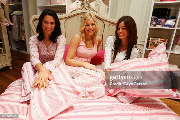 Newsreader Sara Groen, Model Jamie Wright and Kirsty Lee-Allan pose in bed for the launch of 'Girls Night In' at the Peter Alexander store in Pitt...