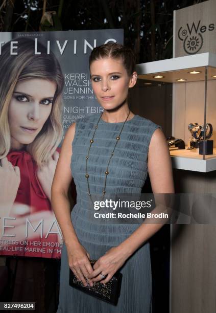 Actress/producer Kate Mara poses in front of her cover image at the Haute Living Celebrates Kate Mara with Westime event on August 7, 2017 in Los...