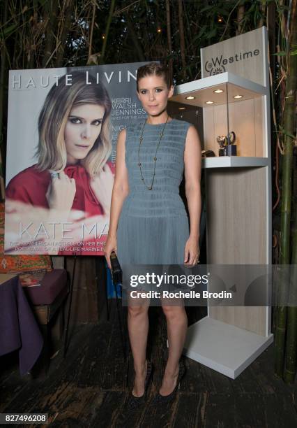 Actress/producer Kate Mara poses in front of her cover image at the Haute Living Celebrates Kate Mara with Westime event on August 7, 2017 in Los...