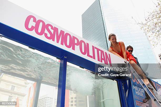 Personality Jaynie Seal climbs out of the underwater tank during the Cosmopolitan Neutrogena Underwater Fashion Shoot at Customs House on September...