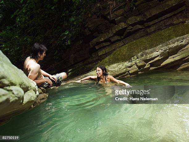 young couple having a conversation - las posas stock pictures, royalty-free photos & images
