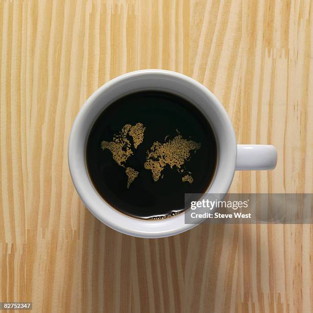 coffee cup with world map composed of bubbles - coffee map world fotografías e imágenes de stock