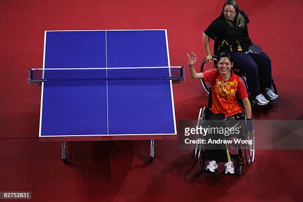 Liu Jing of China celebrates after beating Pamela Pezzutto of Italy in the final of the Women's WIC1-2 Table Tennis event at the Peking University...