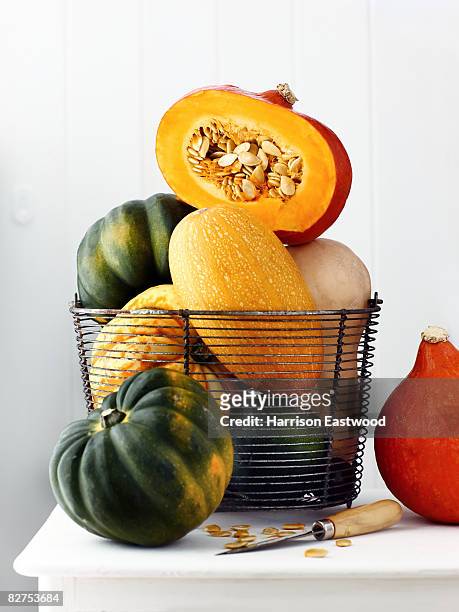 variety of squashes on sideboard one cut open - squash vegetable stock pictures, royalty-free photos & images