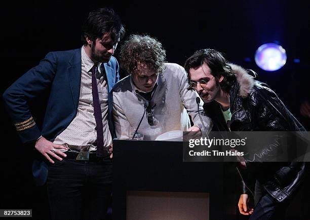 Peter Hume, Dann Hume, and Jon Hume of Evermore present the award for the Most Performed Work in New Zealand at the 2008 APRA Silver Scroll Awards at...