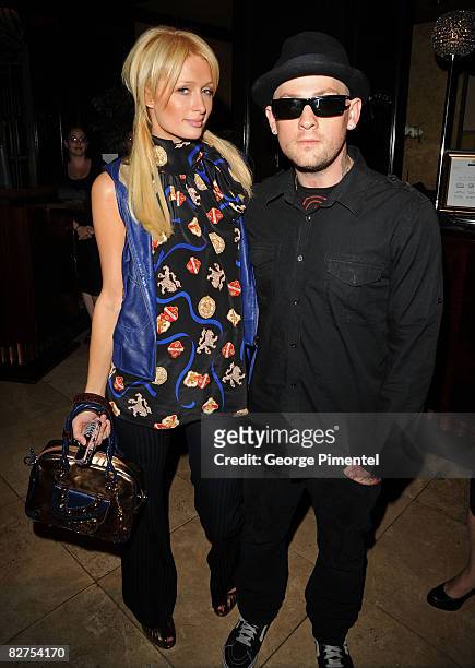 Socialite Paris Hilton and musician Benji Madden attend the InStyle and the Hollywood Foreign Press Association's Toronto Film Festival Party held at...