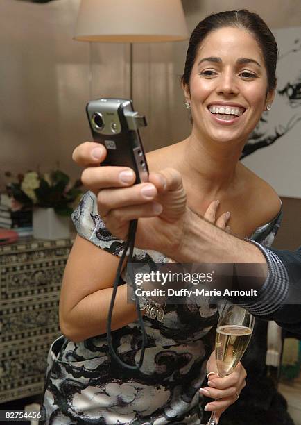 Actress Anna Ortiz looks at the Kodak Zi6 Camera while attending Microsoft's Great American Style at Robert Verdi's Luxe Laboratory on September 9,...