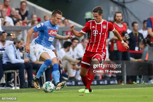 Piotr Zielinski of Neapel and Marco Friedl of Bayern Muenchen battle for the ball during the Audi Cup 2017 match between SSC Napoli and FC Bayern...