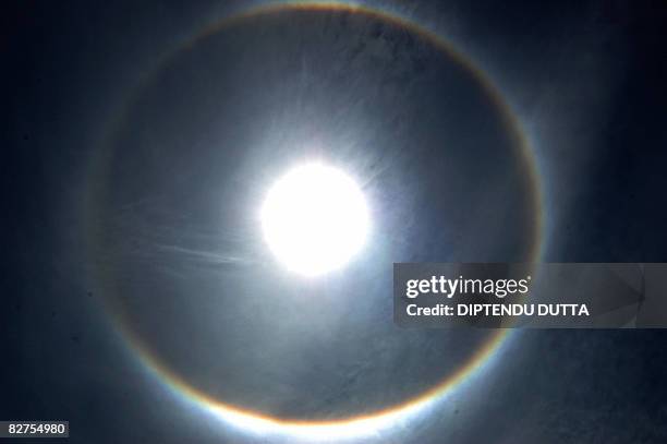 Solar Halo is seen in the sky in Siliguri on September 10, 2008. The solar halo is an atmospheric optical phenomenon that is caused by ice crystals...