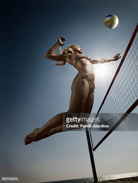 female beach volleyball - spiking stock-fotos und bilder