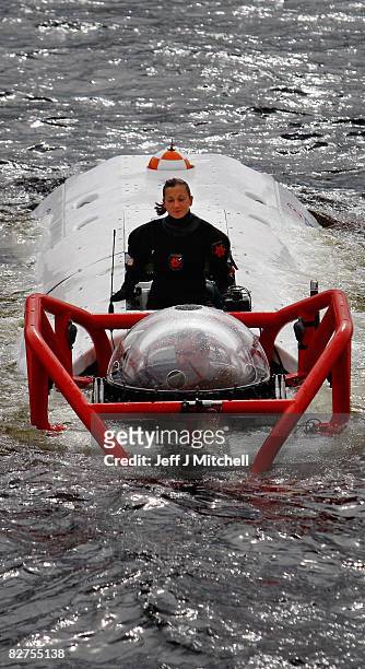 Diver stands on the LR7 rescue submarine is lowered into Loch Linnhe at Fort William where it is undergoing trials on September 10, 2008 in Fort...