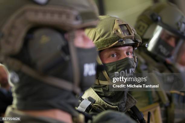 Officiers of the Police special forces or GSG9 stand during the opening of the new Headquarters on August 8, 2017 in Berlin. Starting from August all...